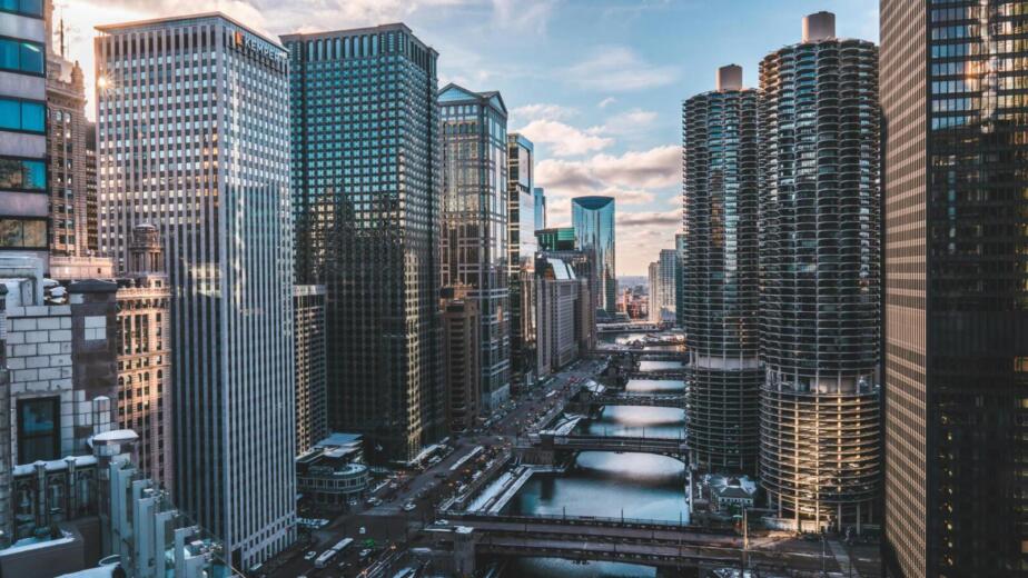 A breathtaking view of Chicago's iconic skyscrapers and waterway at day with a clear sky.