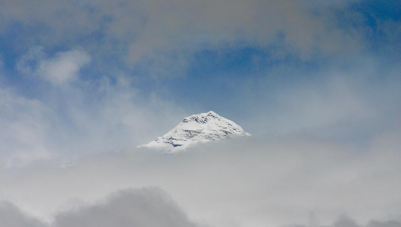 snow covered mountain under blue sky