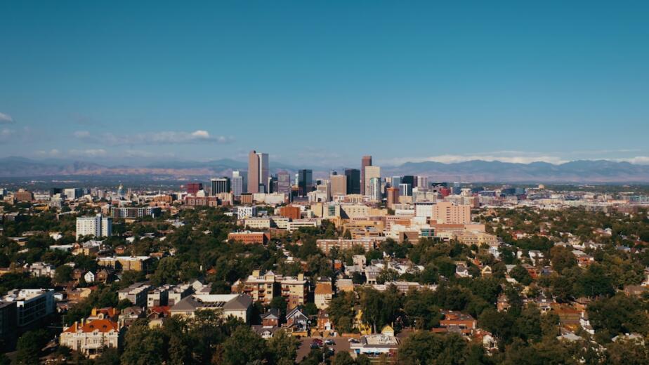 a view of a city with mountains in the background