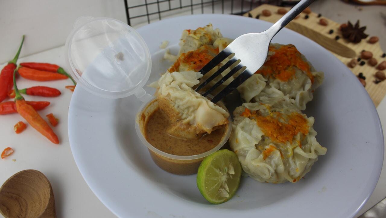 a white plate topped with food and a fork